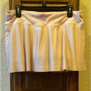 Pleat to street mid-rise skirt. Blush Pink. Very light pink